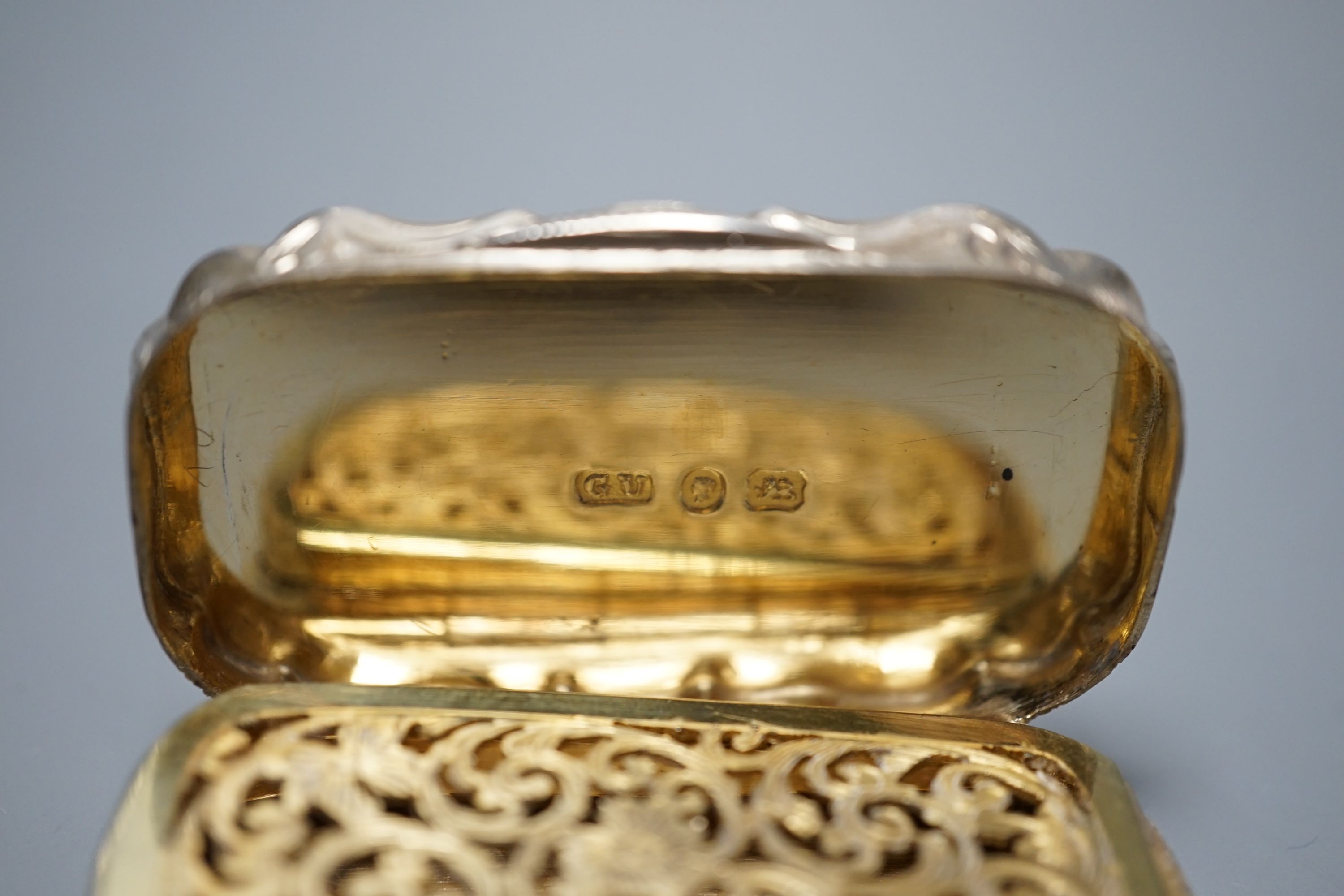 A Victorian engine turned silver shaped oval vinaigrette, by George Unite, Birmingham, 1868, 54mm.